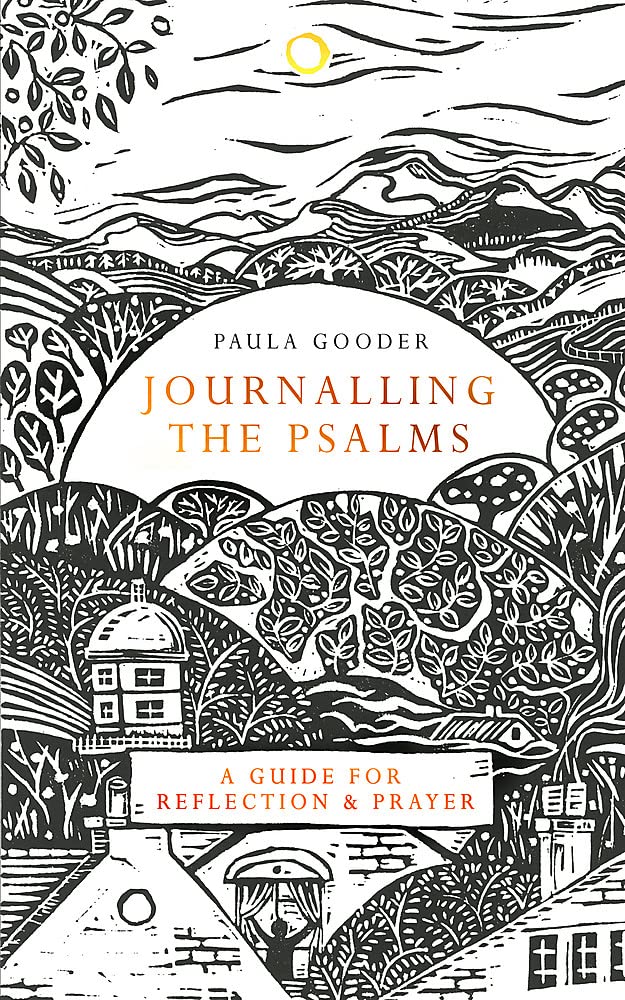 Hardcover journal with an illustration of a person journaling, set against a backdrop of a house, trees, and mountains. The title 'Journalling the Psalms' and the author's name 'Paula Gooder' are featured.