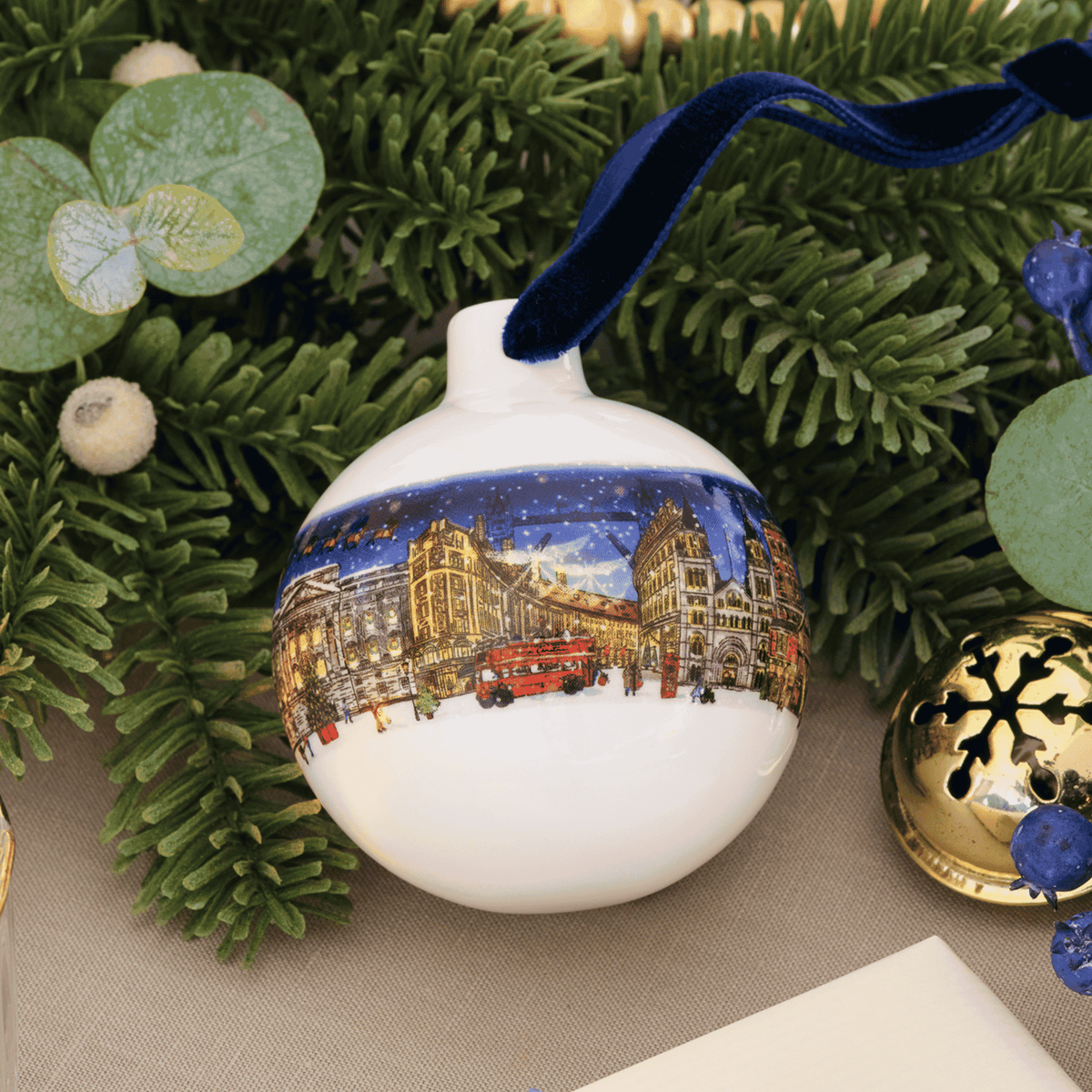 A Bone China bauble with an illustrated London Christmas scene
