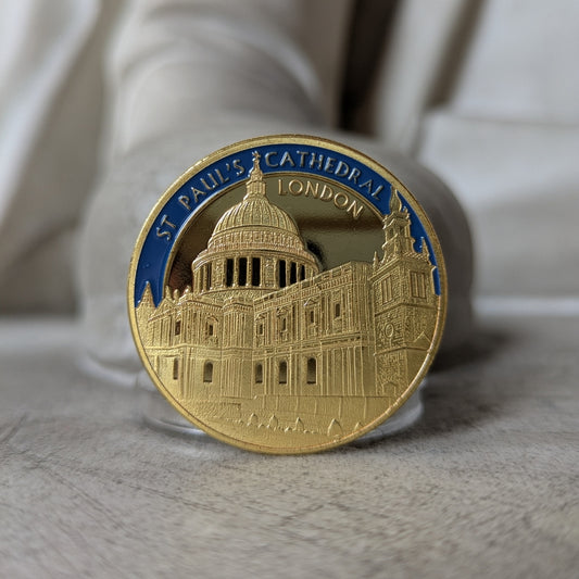 Gold coin with St. Paul's Cathedral design on a white surface