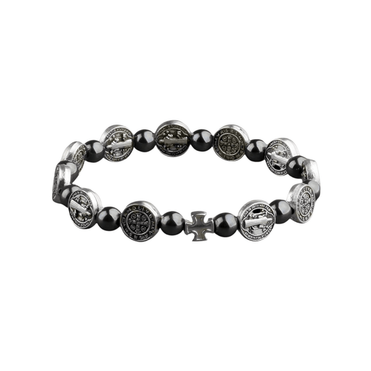 Bracelet with black beads and silver religious symbols on a white background